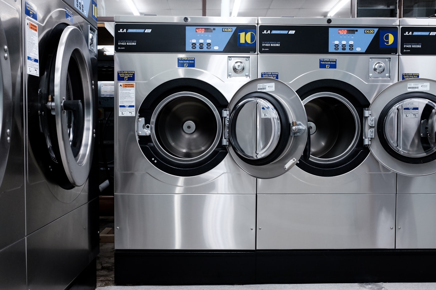 A row of LG front-load washers and dryers in a laundry room — professional appliance repair