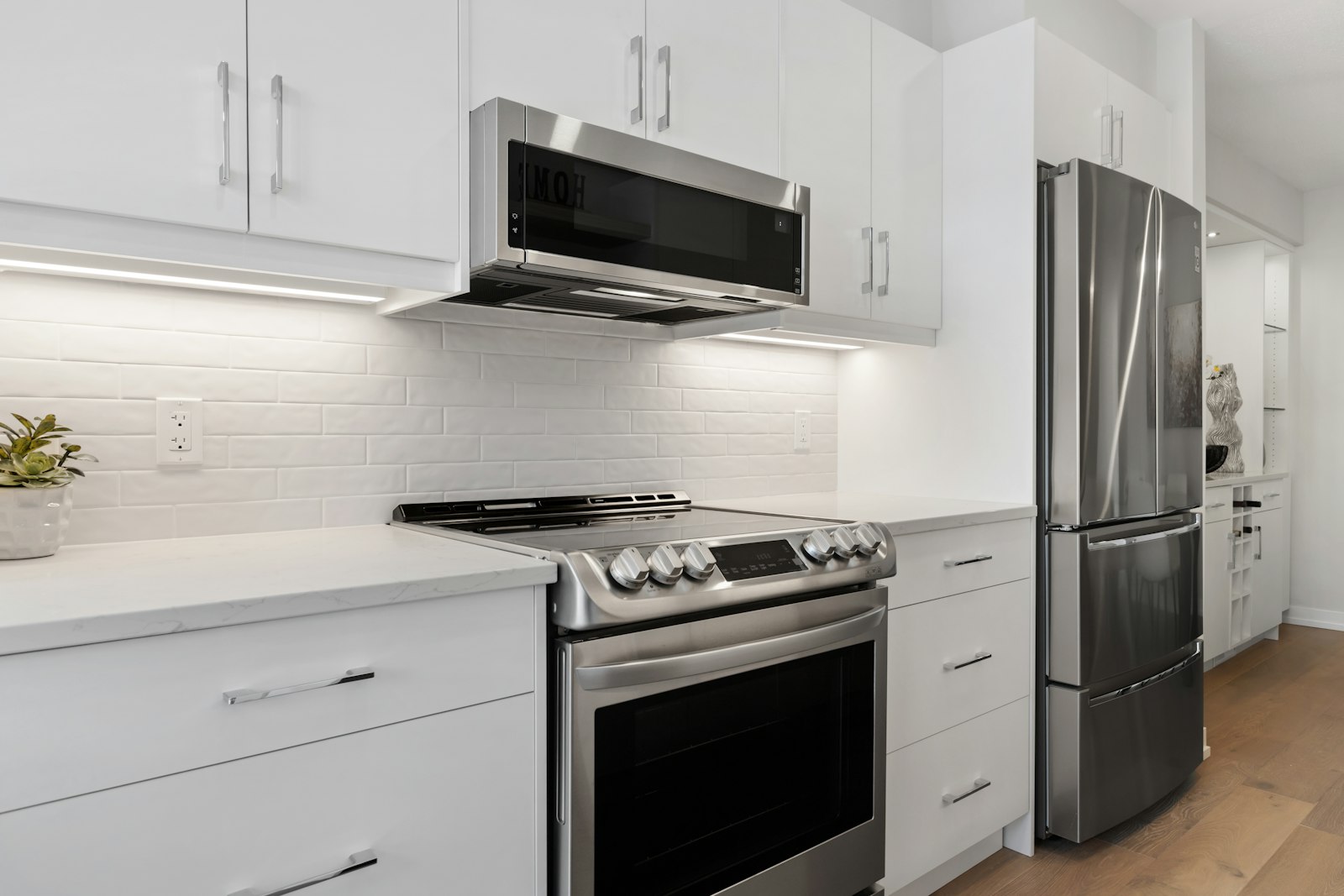 LG over-the-range microwave above a slide-in range — professional appliance repair